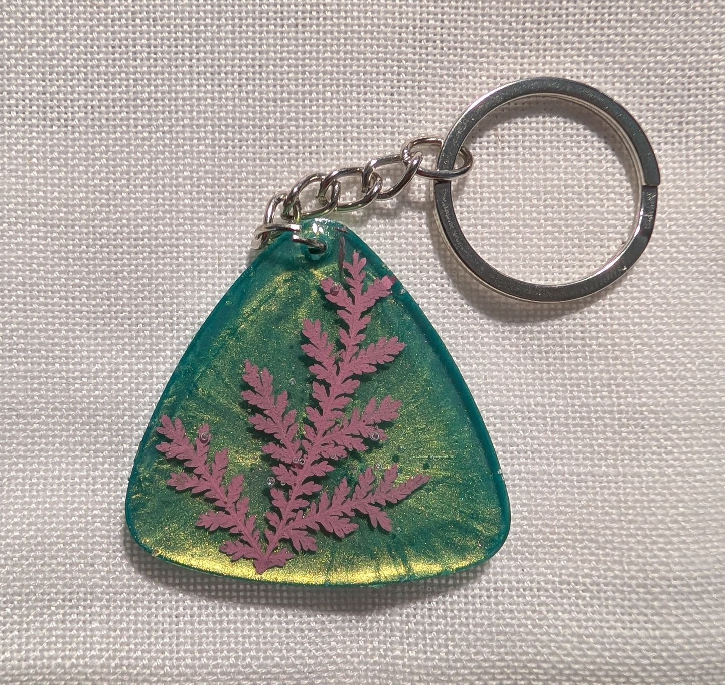 Pink Leaf on Green Background