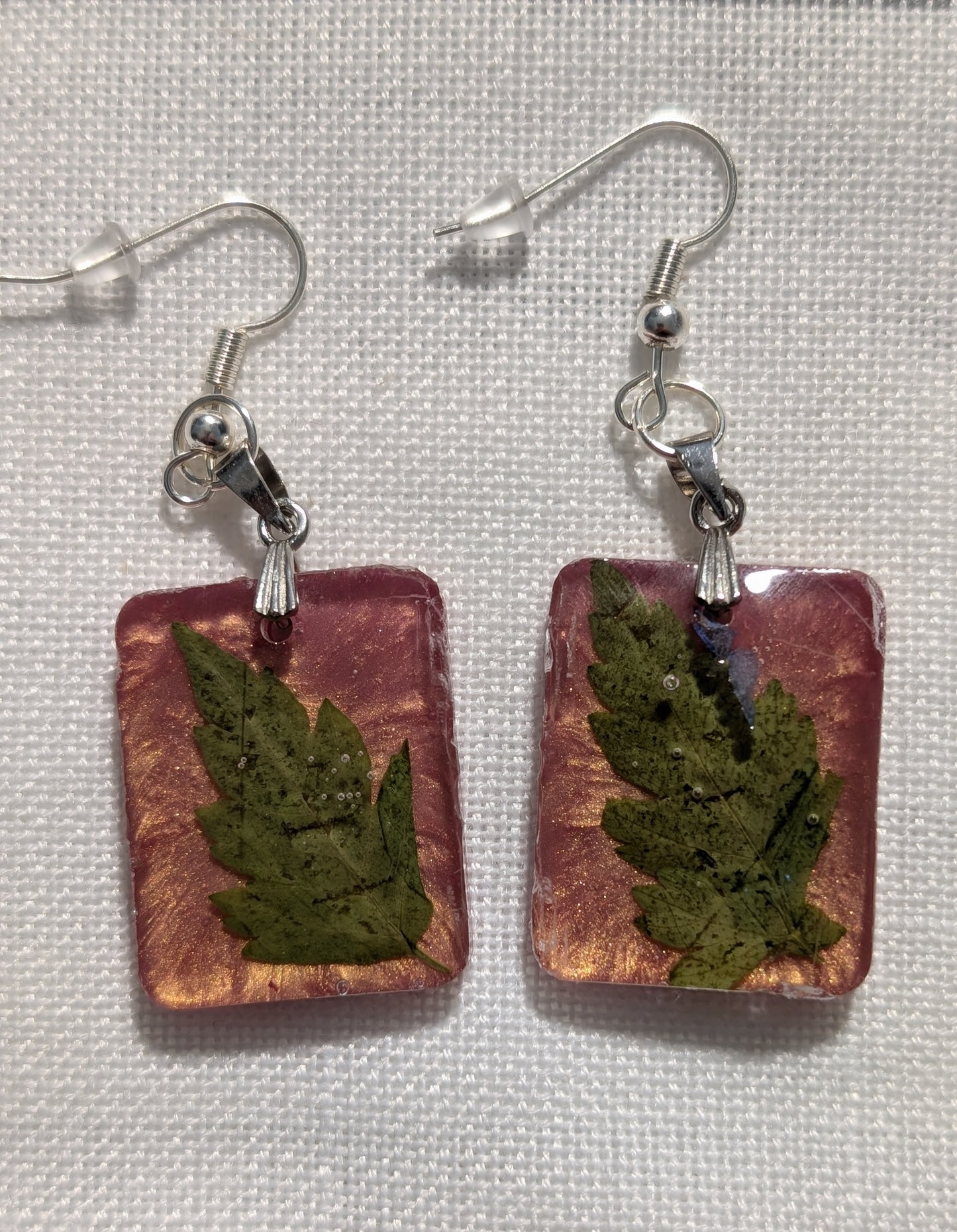 Green Leaf on Rose Gold Background