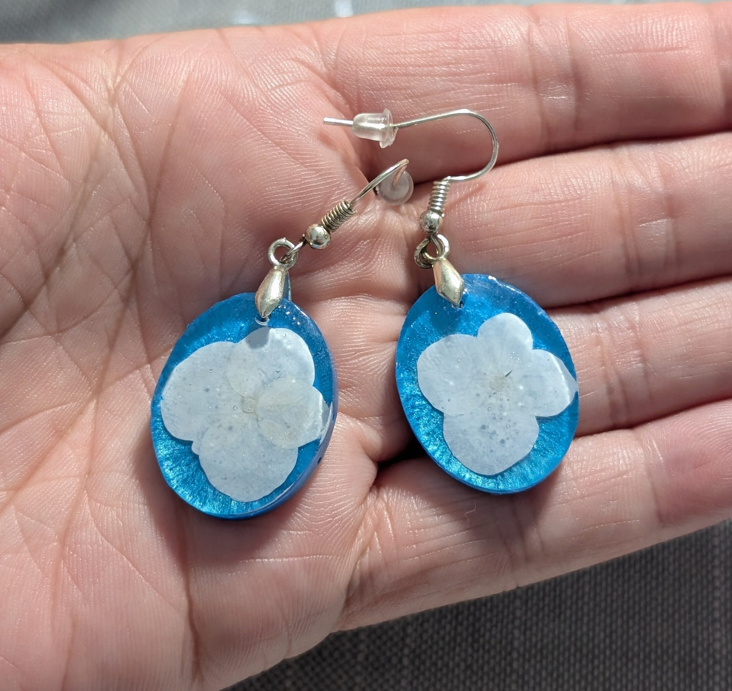 White Wildflowers on Blue Background