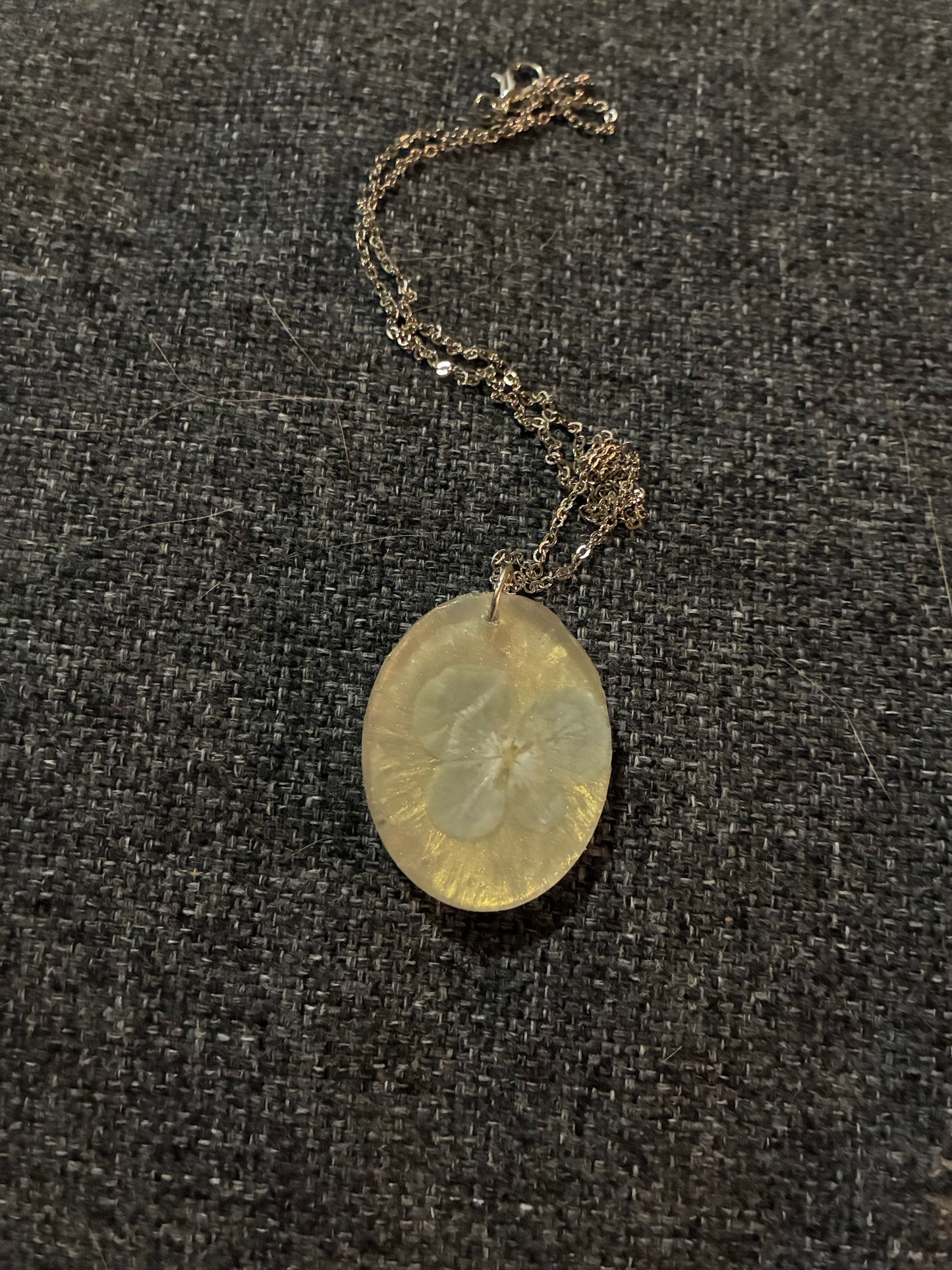 Light blue flower on white pendant