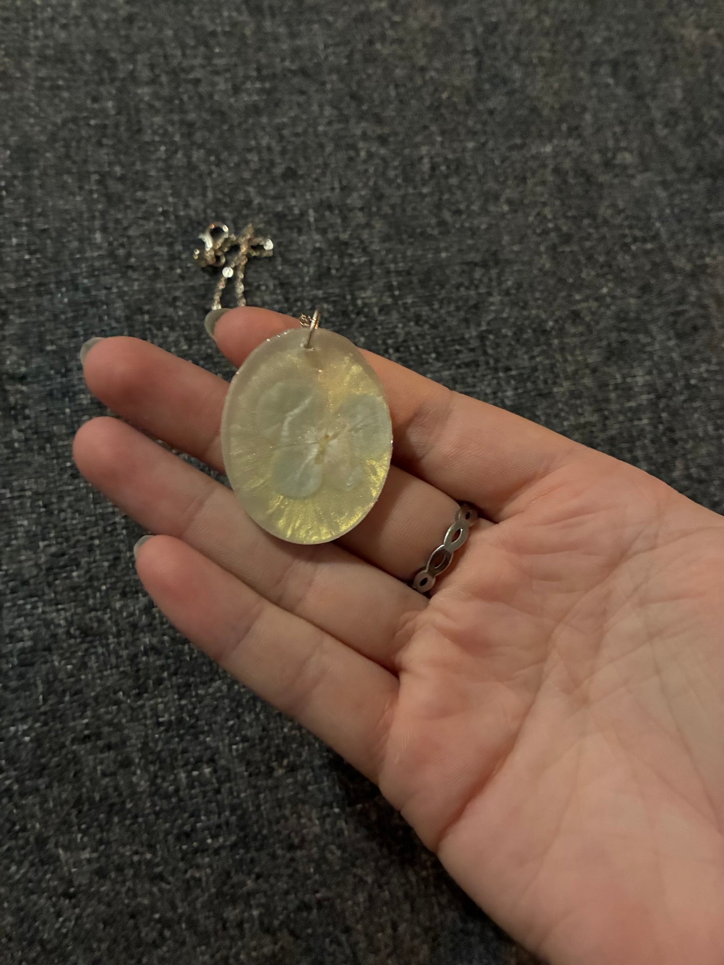 Light blue flower on white pendant