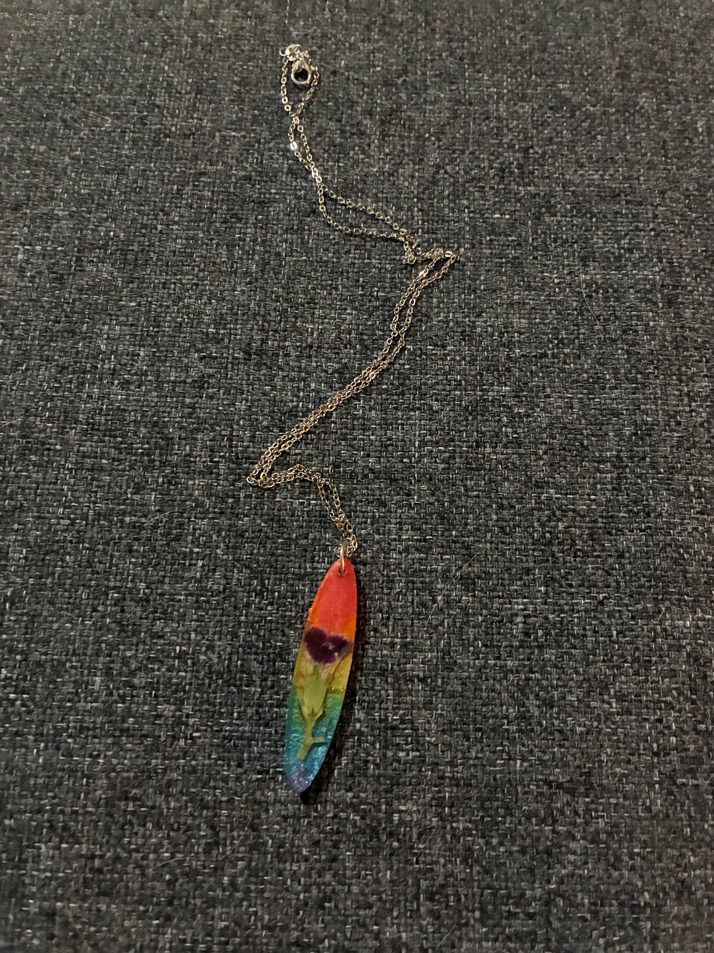 Rainbow necklace with purple flower