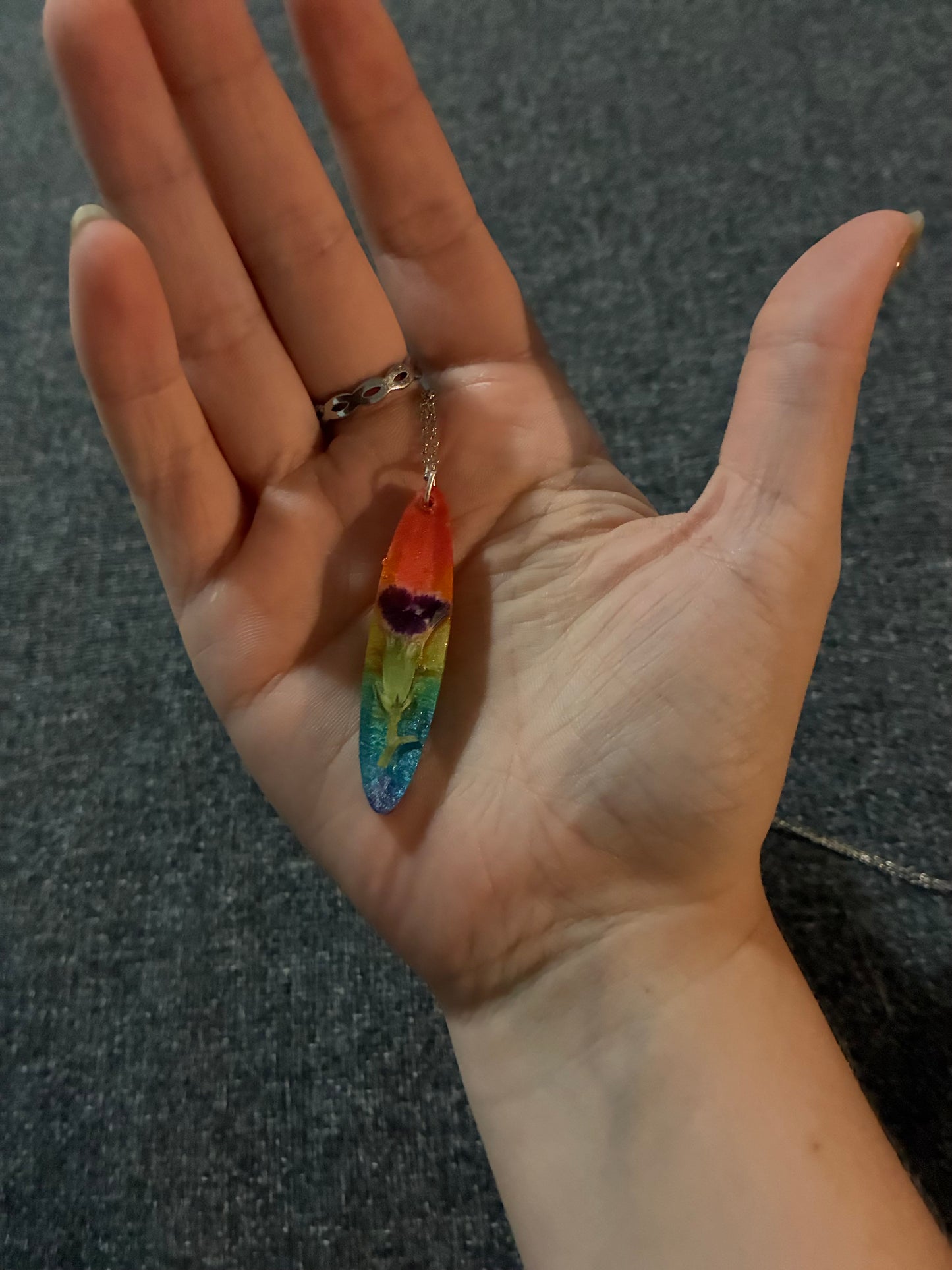 Rainbow necklace with purple flower