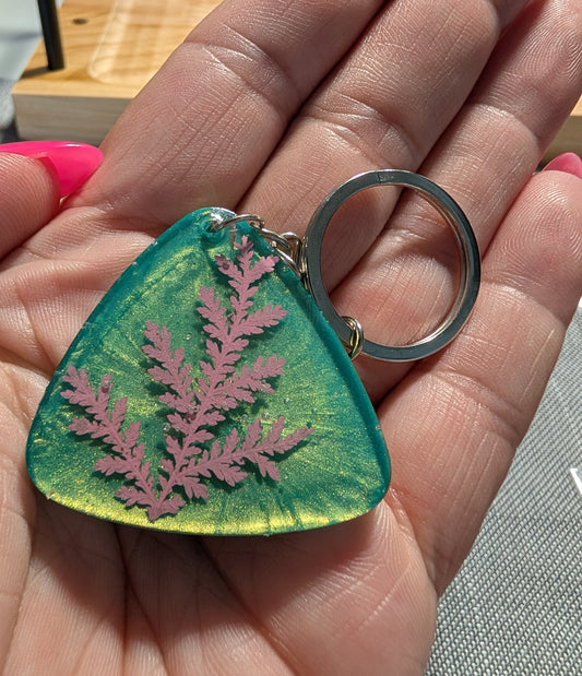 Pink Leaf on Green Background