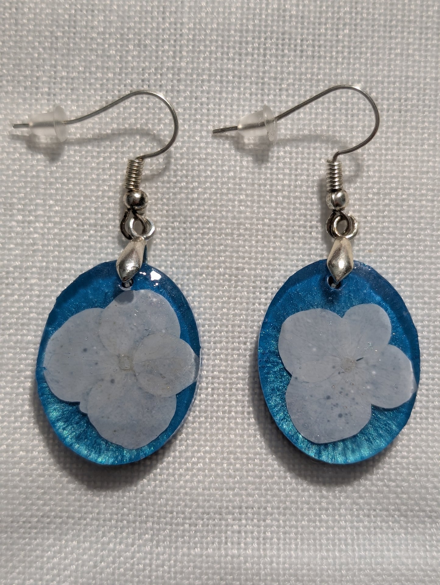 White Wildflowers on Blue Background